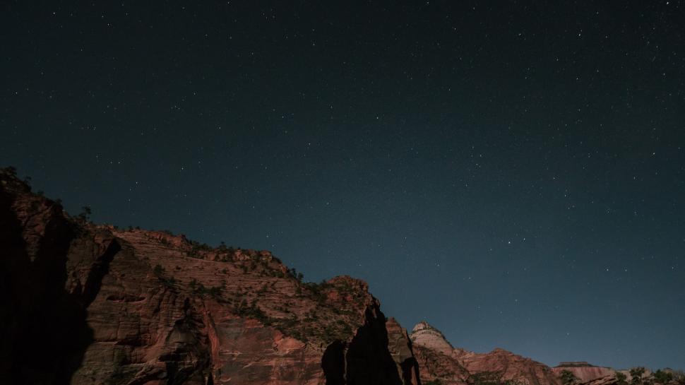 Free Image of Sparse Stars Above Mountain Peak 