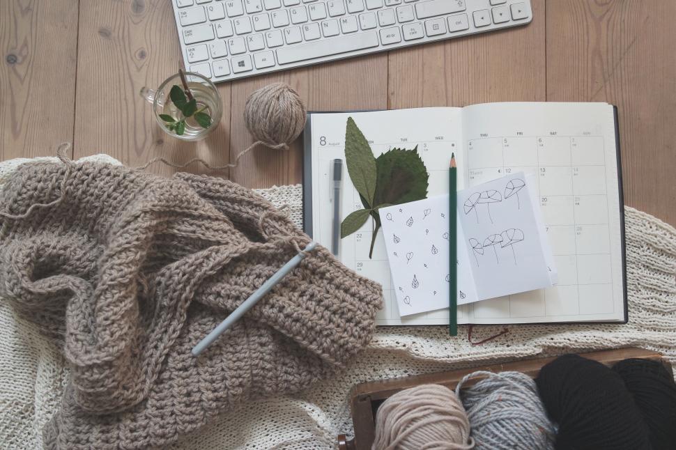 Free Image of Book, Yarn, and Keyboard on Wooden Floor 