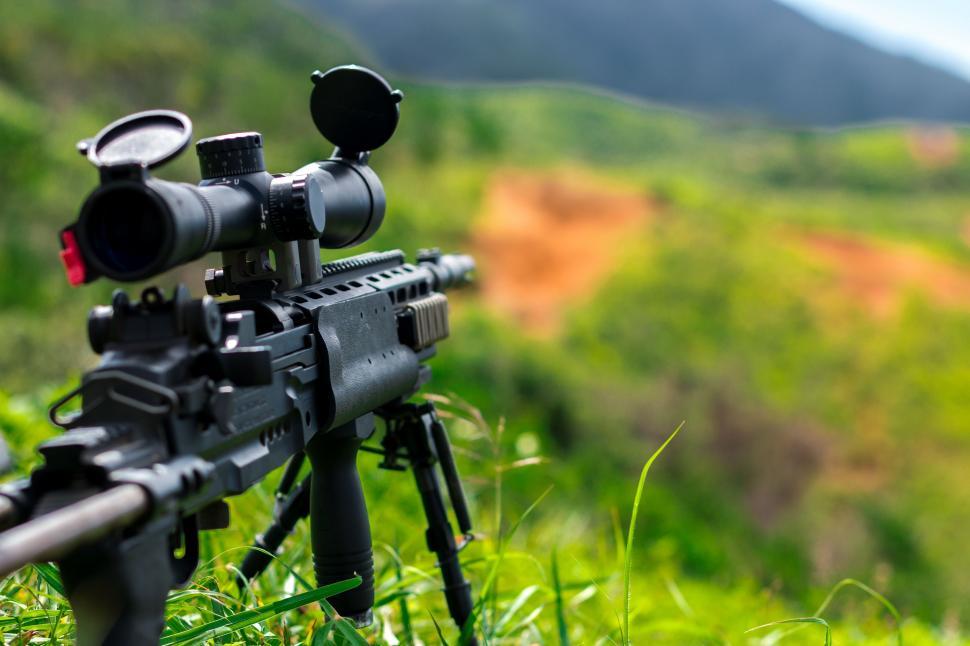 Free Image of Close Up of Rifle on Tripod 