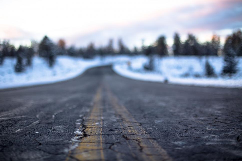 Free Image of Blurry Road With Trees in Background 