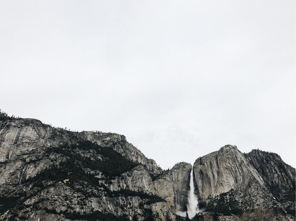 Free Image of Majestic Waterfall Cascading in Black and White 