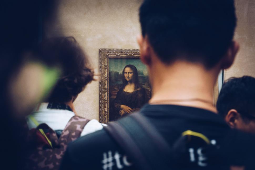 Free Image of Group of People Standing in Front of a Painting 