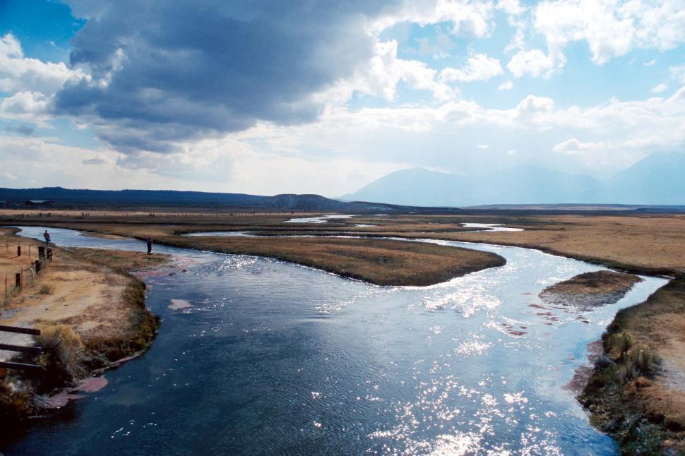 Free Image of River Flowing Through Dry Grass Field 