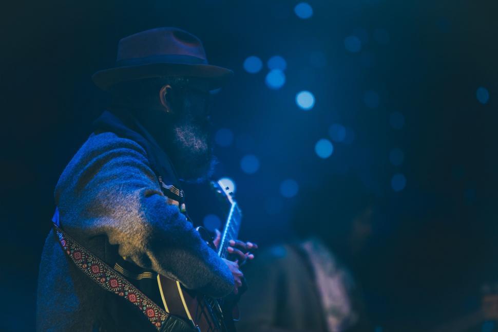 Free Image of Man Playing Guitar on Stage 