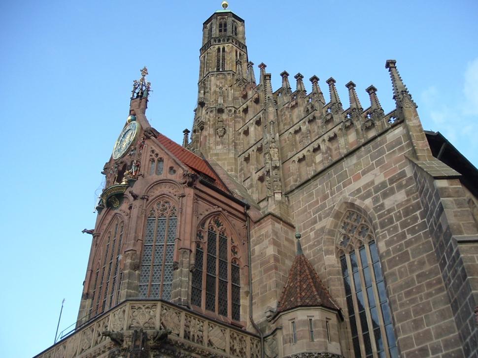 Free Image of Towering Building With Clock on Side 