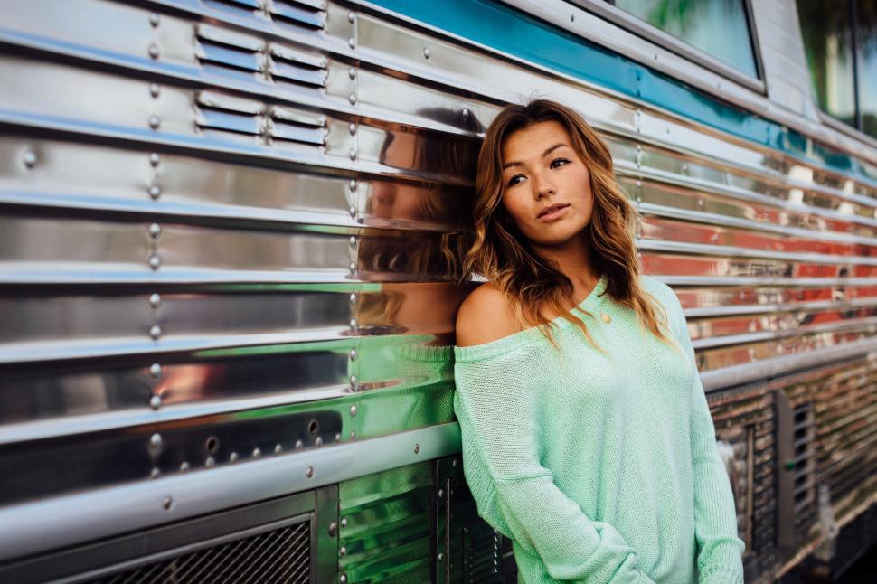 Free Image of Woman Leaning Against Side of Train 