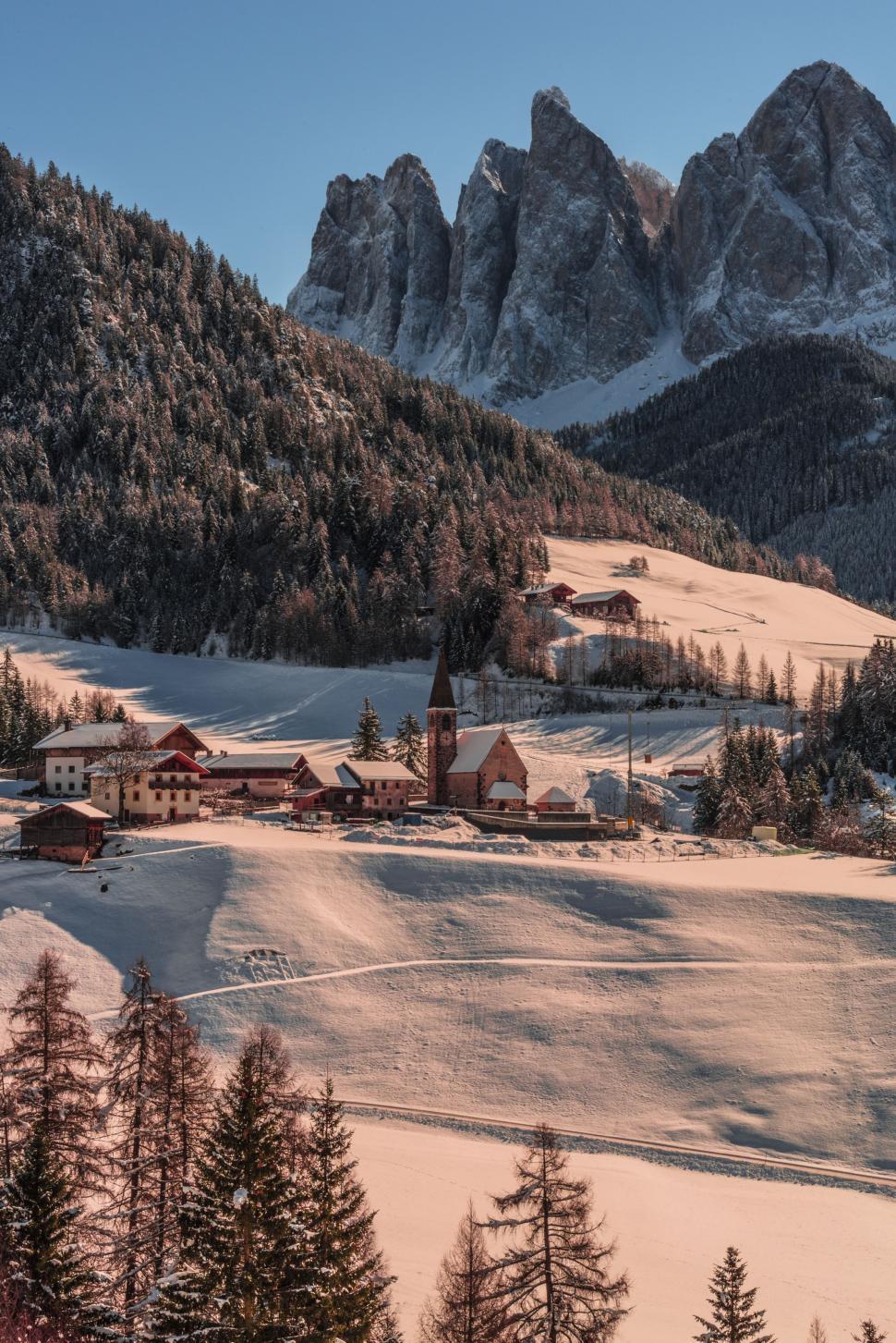 Free Image of Snowy Landscape With Mountains in the Background 