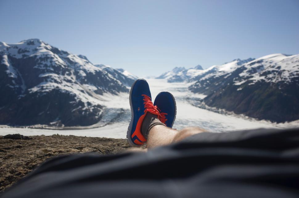 Free Image of Person Laying on Snow Covered Mountain 