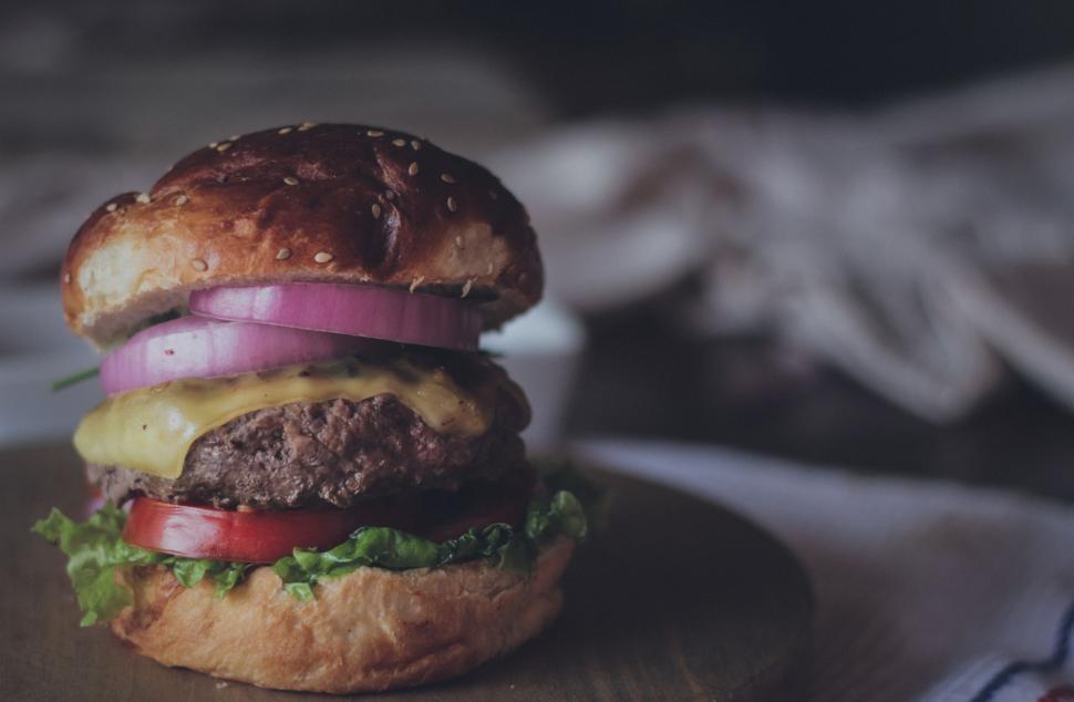 Free Image of Hamburger on Wooden Cutting Board 