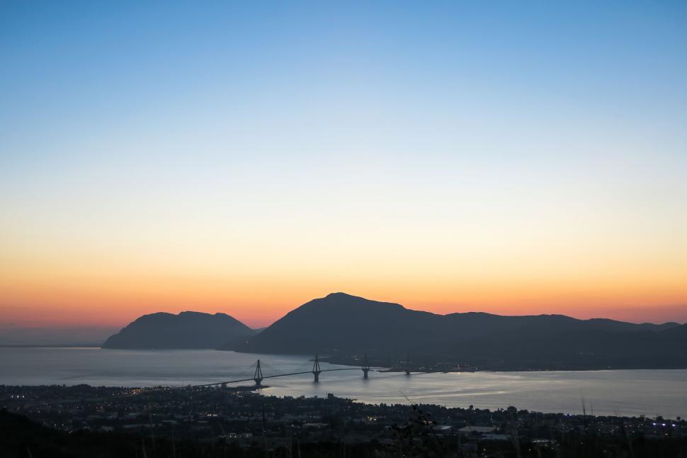 Free Image of Majestic Mountains Overlooking a Body of Water 