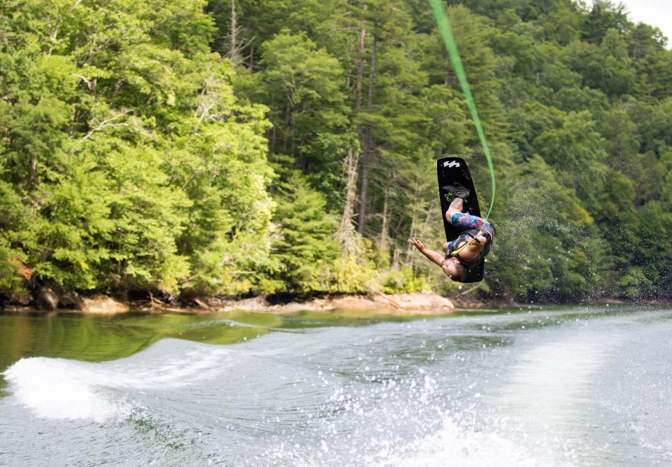 Free Image of Person Wakeboarding Behind Boat 