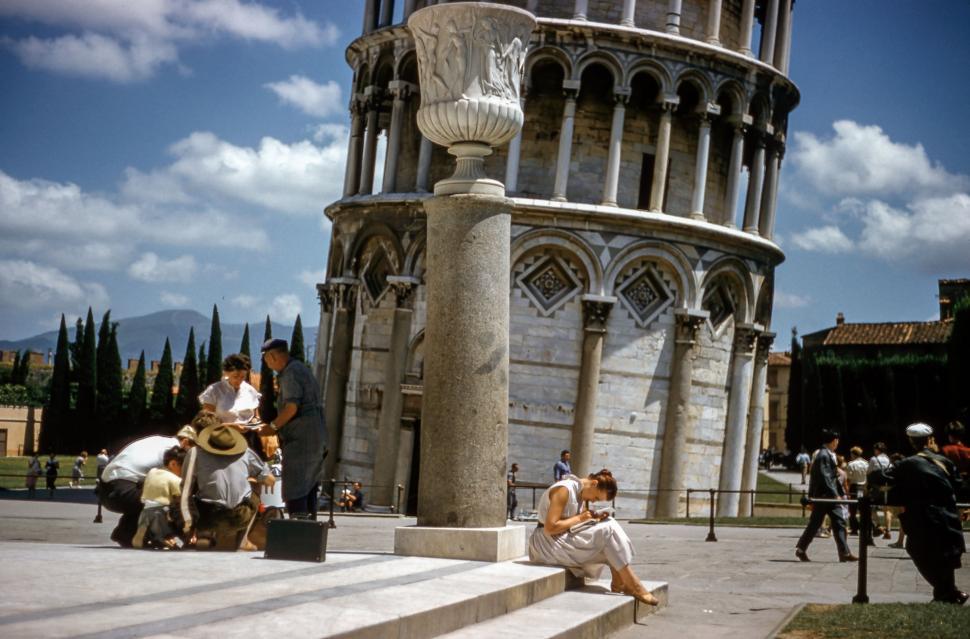 Free Image of Group of People Sitting on the Steps of a Building 