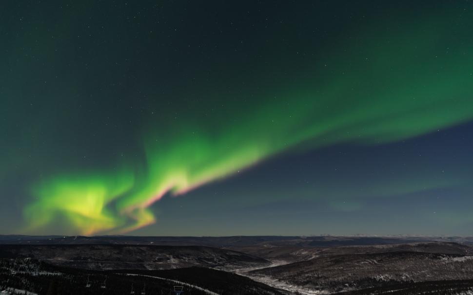 Free Image of Green and Yellow Aurora Borealis in the Night Sky 