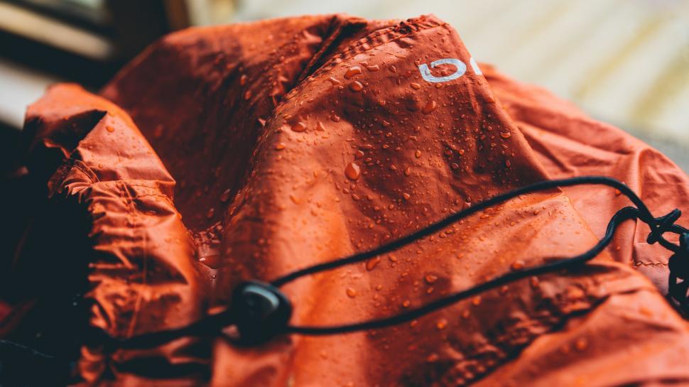 Free Image of Red Jacket With Black Cord 