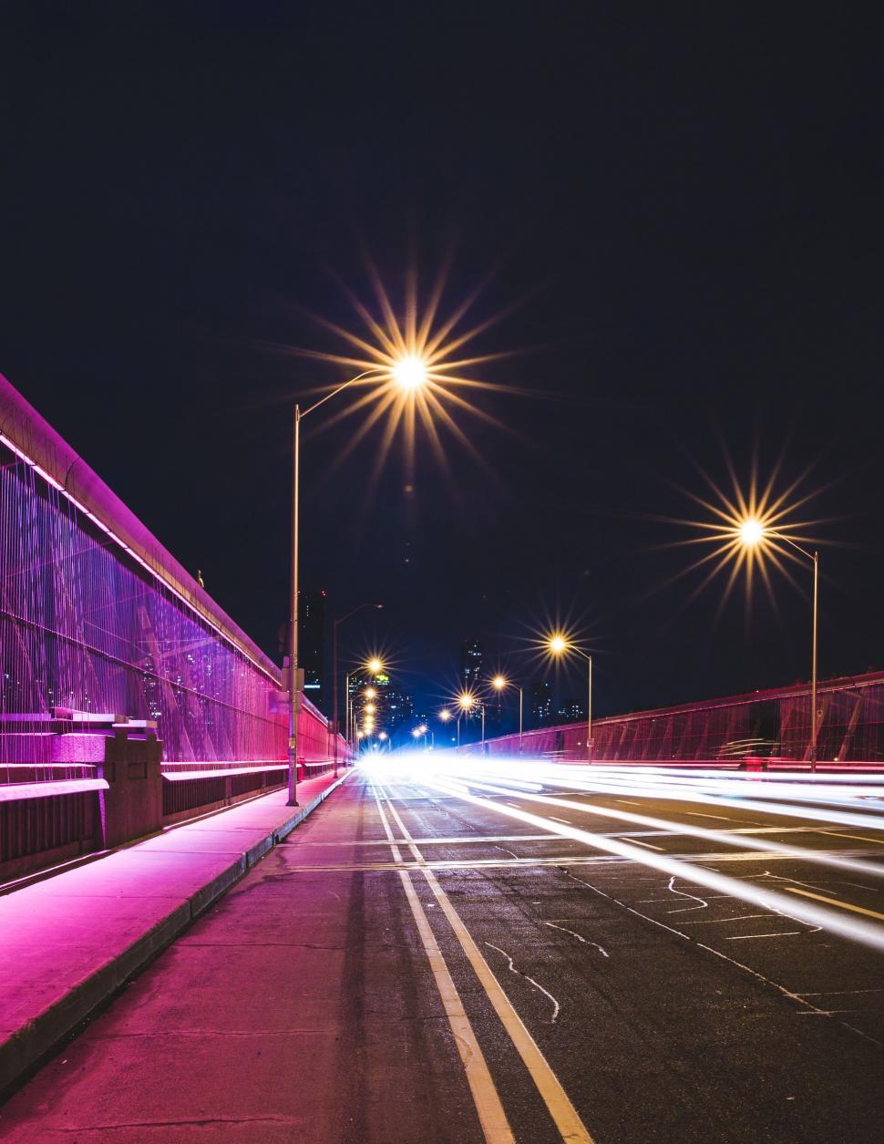Free Image of Vibrant City Street With Bright Lights at Night 