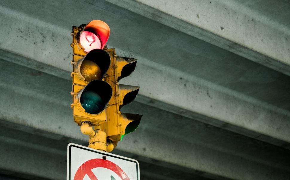 Free Image of Traffic Light Hanging From Side of Building 