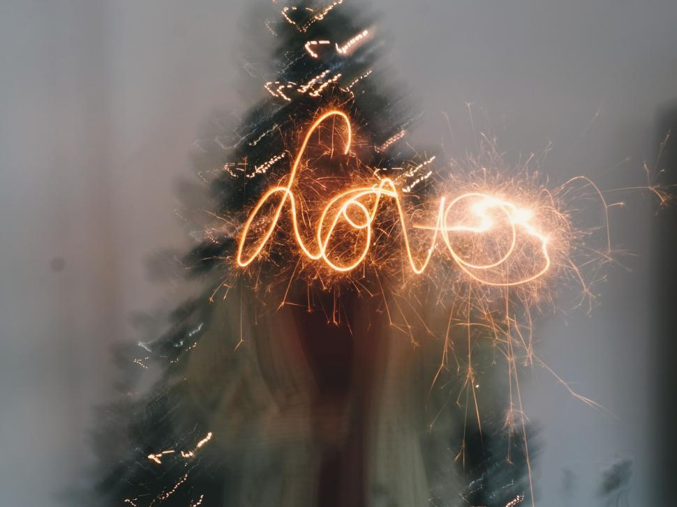 Free Image of Christmas Tree Illuminated by Sparklers 