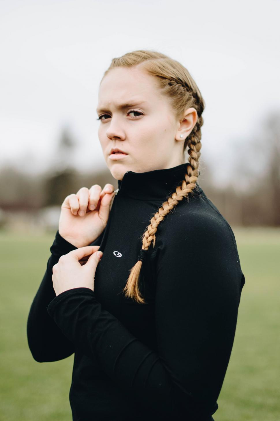 Free Image of Woman With Braid Standing in Field 
