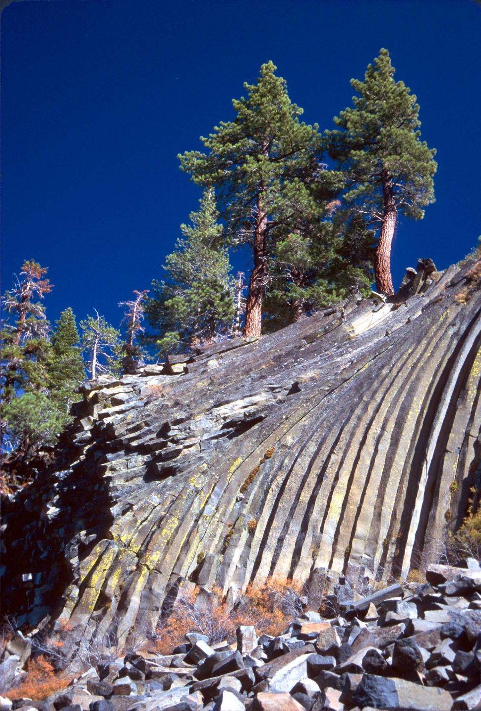 Free Image of Massive Rock Formation Alongside Mountain 
