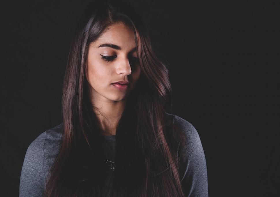 Free Image of Woman With Long Dark Hair and Eyes Closed 