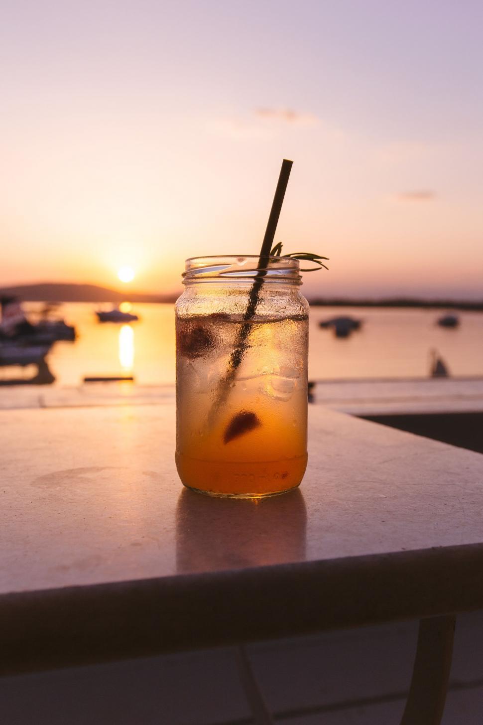 Free Image of Mason Jar Filled With Drink on Table 