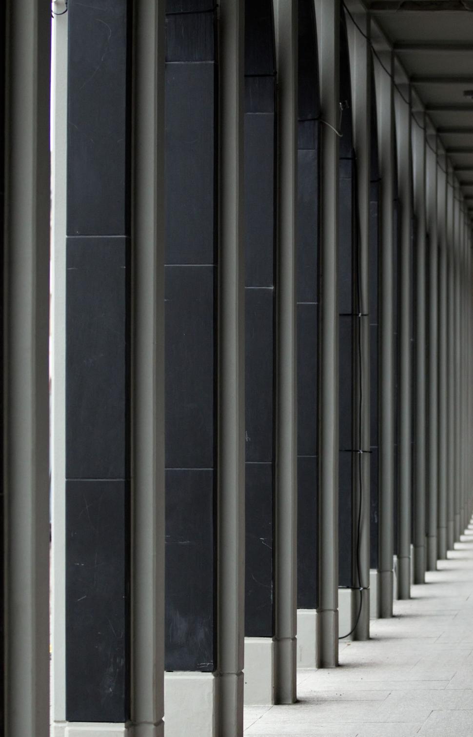 Free Image of Row of Black and White Poles 