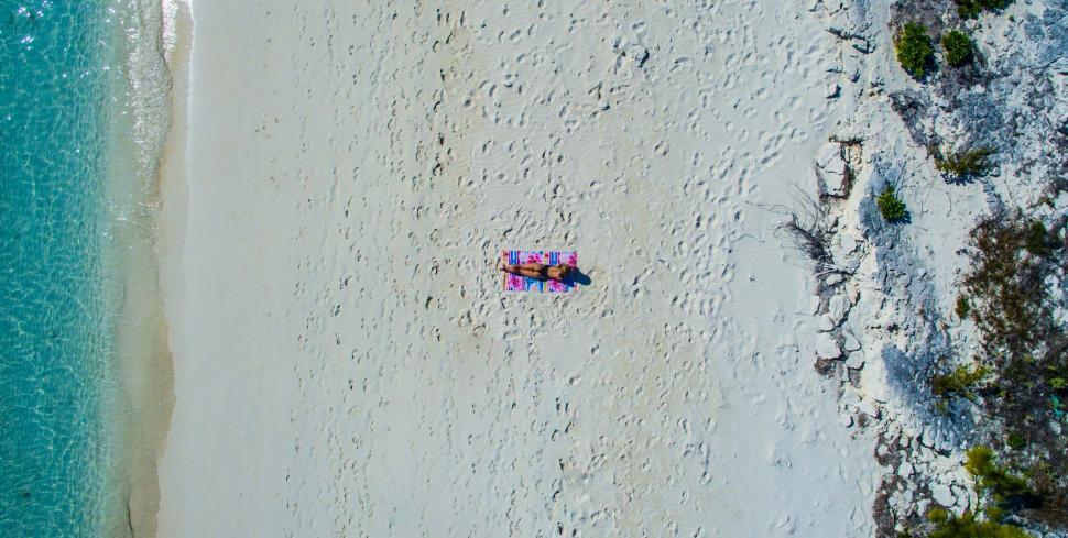 Free Image of Person Relaxing on Beach 