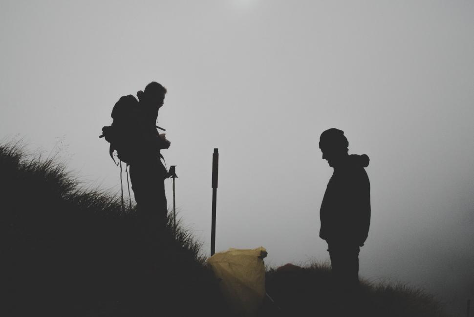Free Image of Couple Standing on Top of Hill 