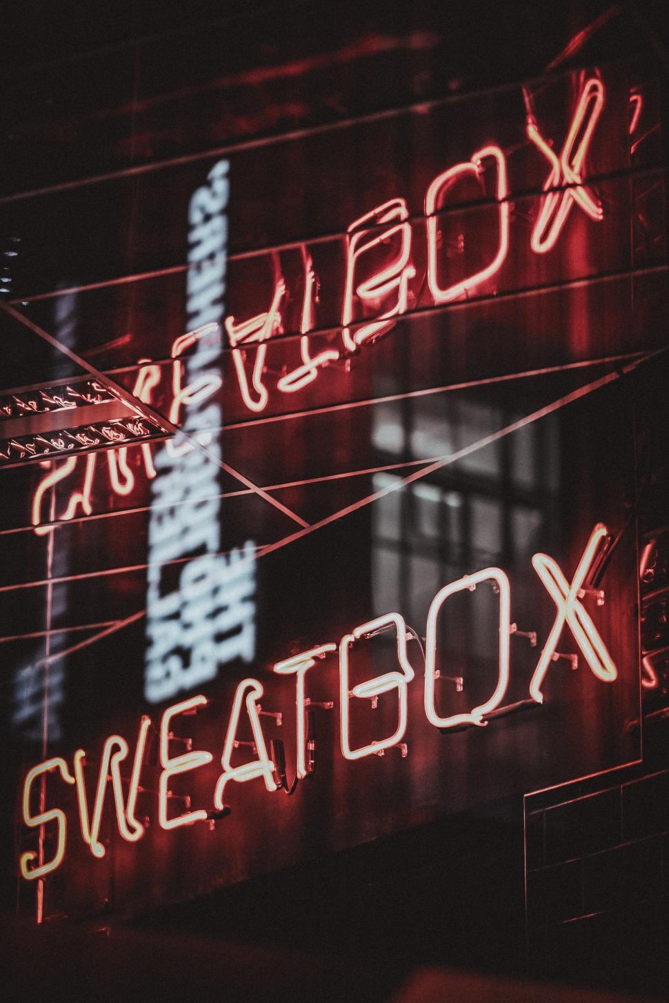 Free Image of Neon Sign on Side of Building 
