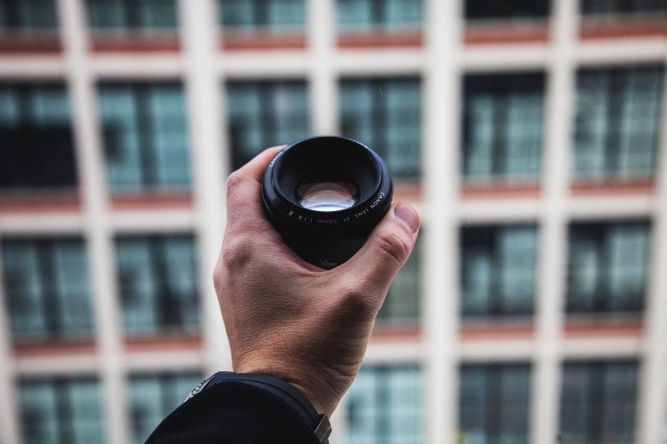 Free Image of Man Holding Camera Up to the Sky 