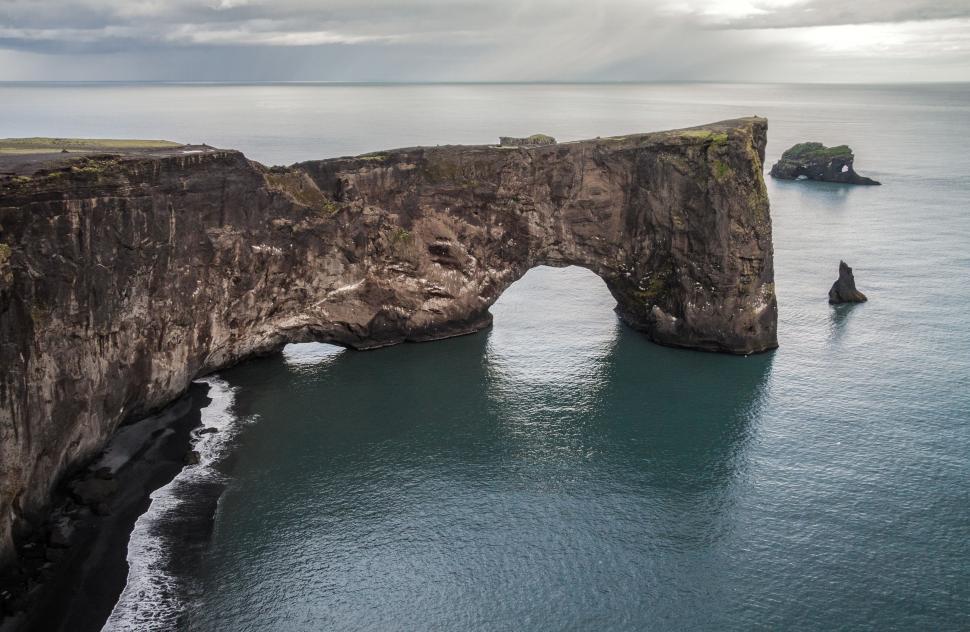 Free Image of Aerial View of Large Rock Formation in the Ocean 
