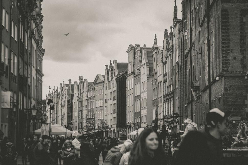 Free Image of Crowd of People Walking Down Urban Street 