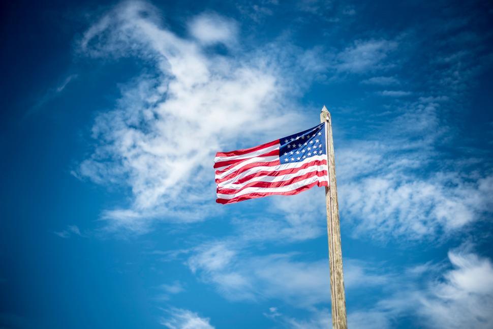 Free Image of American Flag Flying High in the Sky 