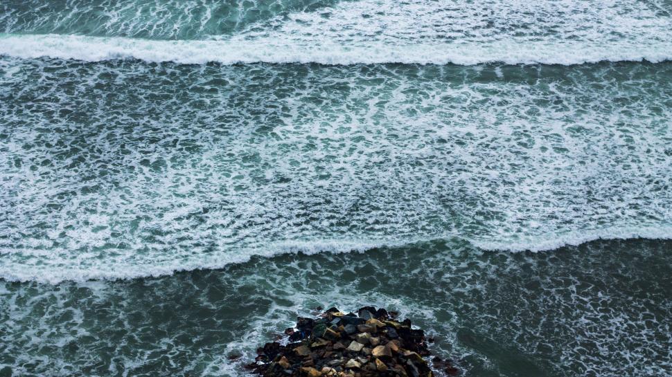 Free Image of Two Rocks on a Beach by the Ocean 