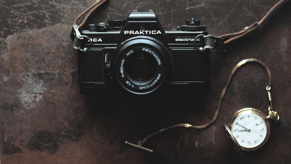 Free Image of Camera and Pocket Watch on Table 