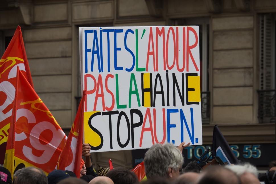 Free Image of Group of People Holding Signs in Front of Building 