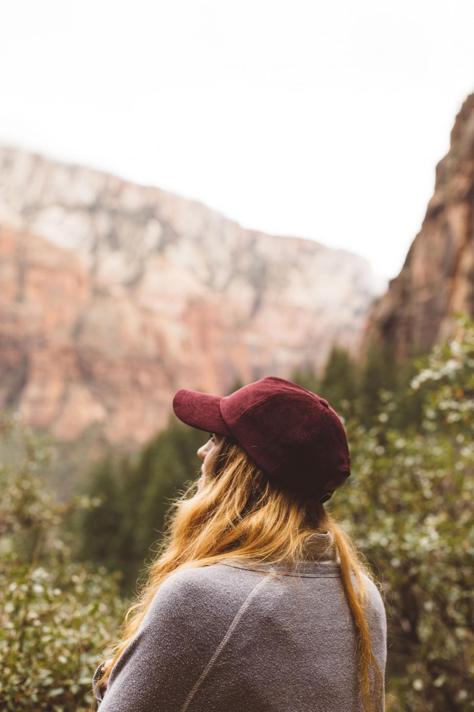 Free Image of Woman With Red Hair Wearing Maroon Hat 
