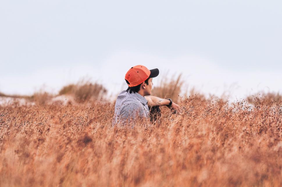 Free Image of Man Relaxing in Tall Grass 
