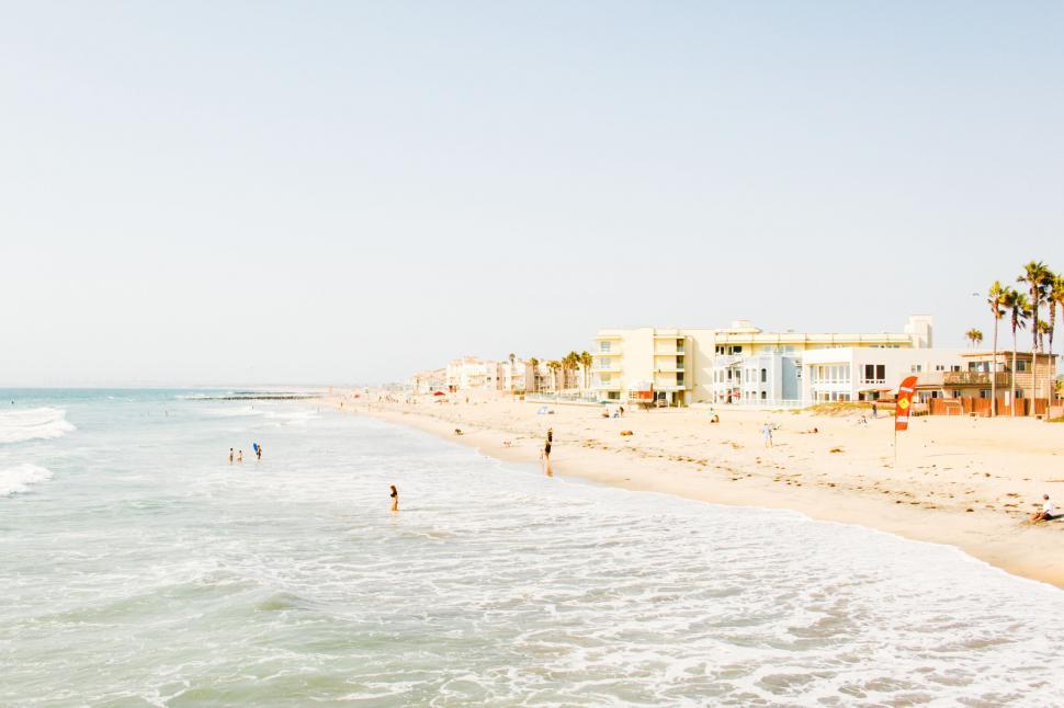 Free Image of People Swimming at Beach Shore 