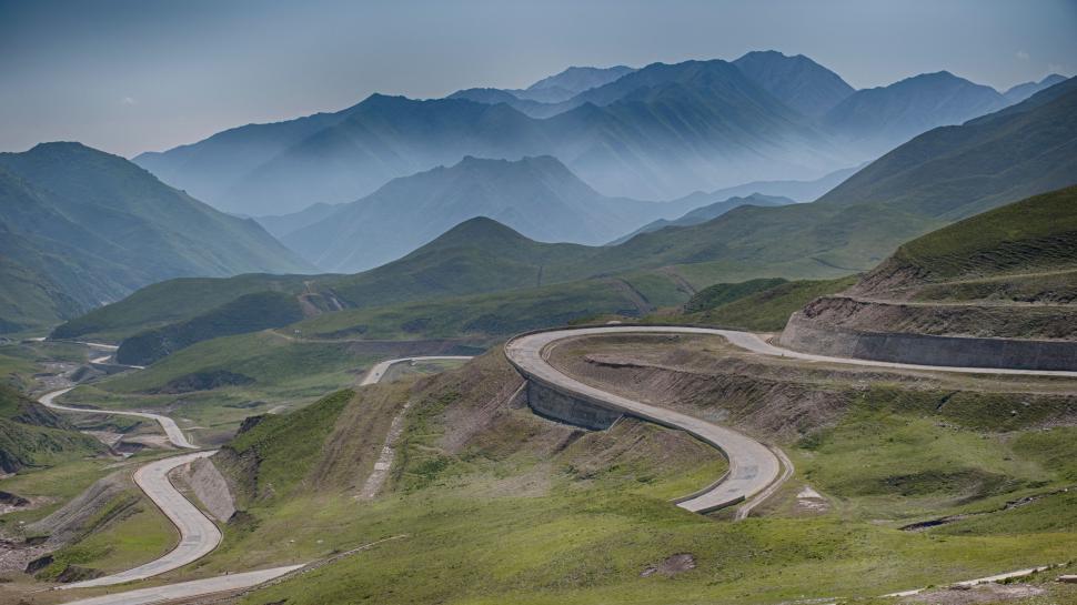 Free Image of Winding Mountain Road Through Valley 