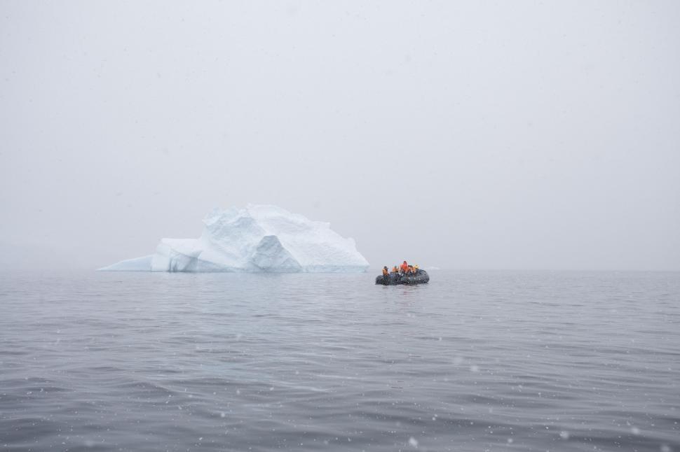 Free Image of Massive Iceberg Drifting in the Middle of a Body of Water 