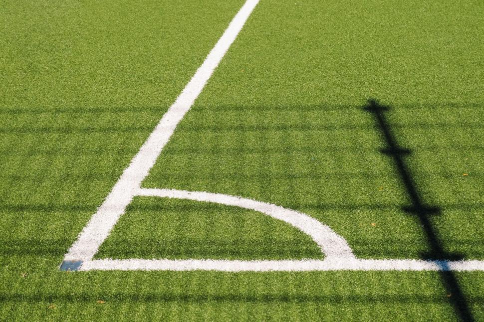 Free Image of Shadow of a Baseball Bat on a Baseball Field 