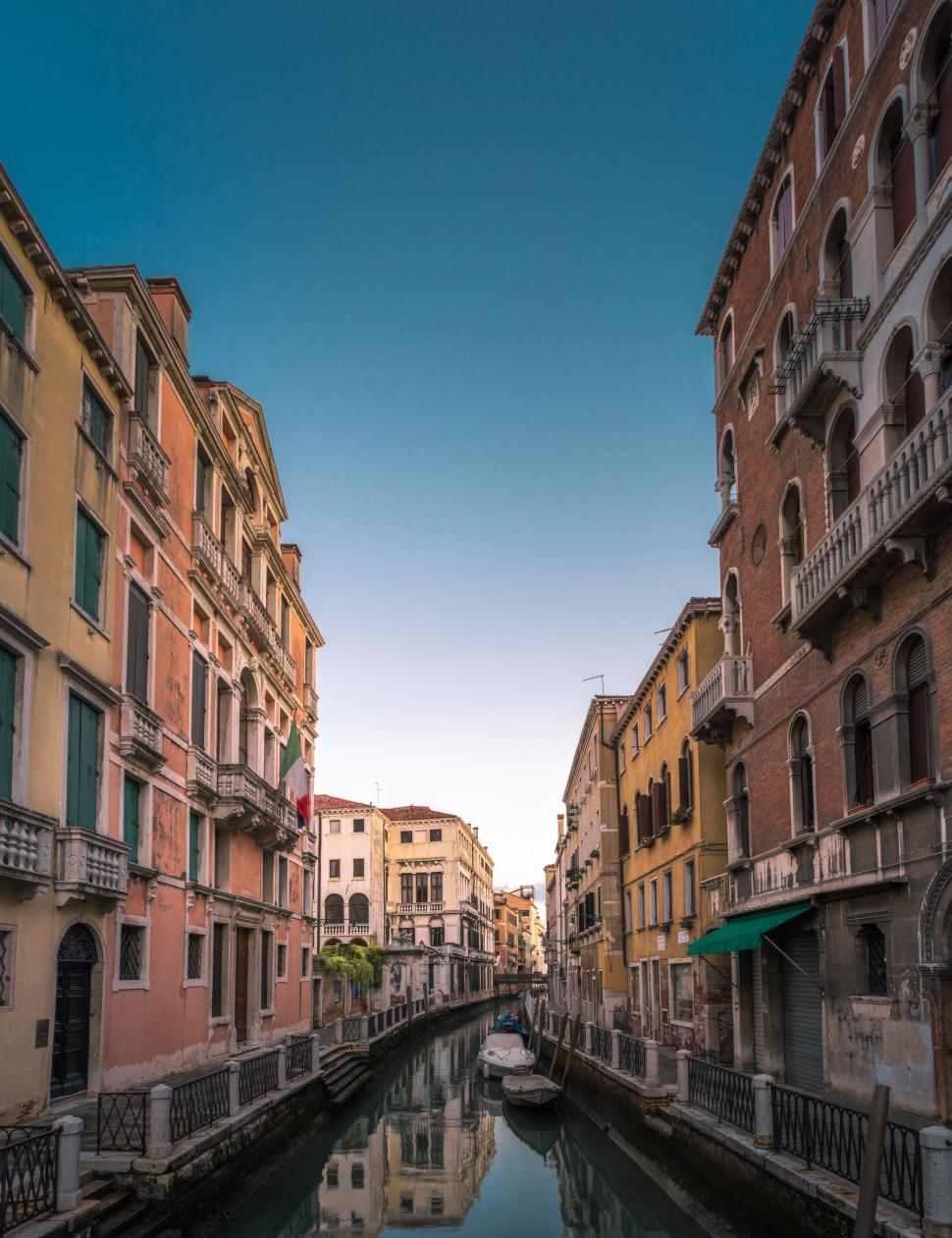 Free Image of Canal Running Through City Next to Tall Buildings 