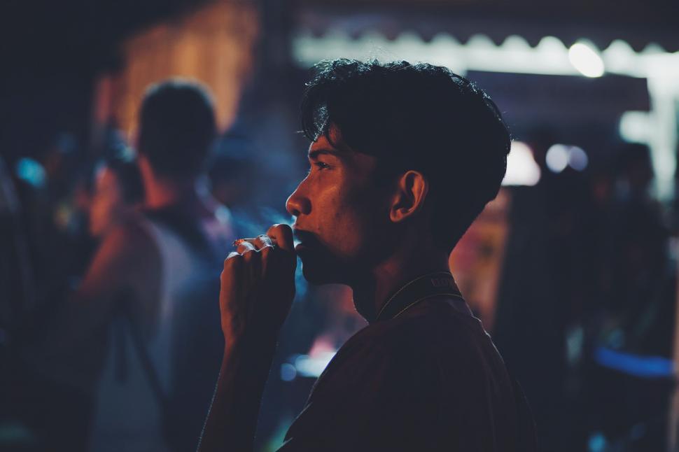 Free Image of Man With Beard Eating Something 