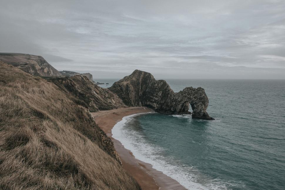 Free Image of Rock Formation in the Middle of Ocean Beach 