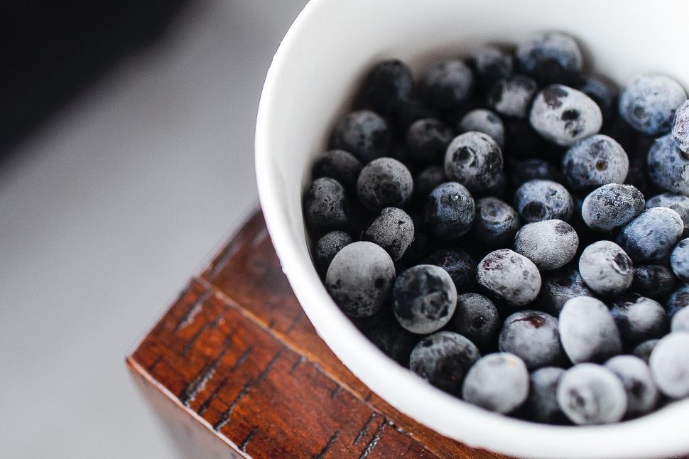 Free Image of White Bowl Filled With Blueberries on Wooden Table 
