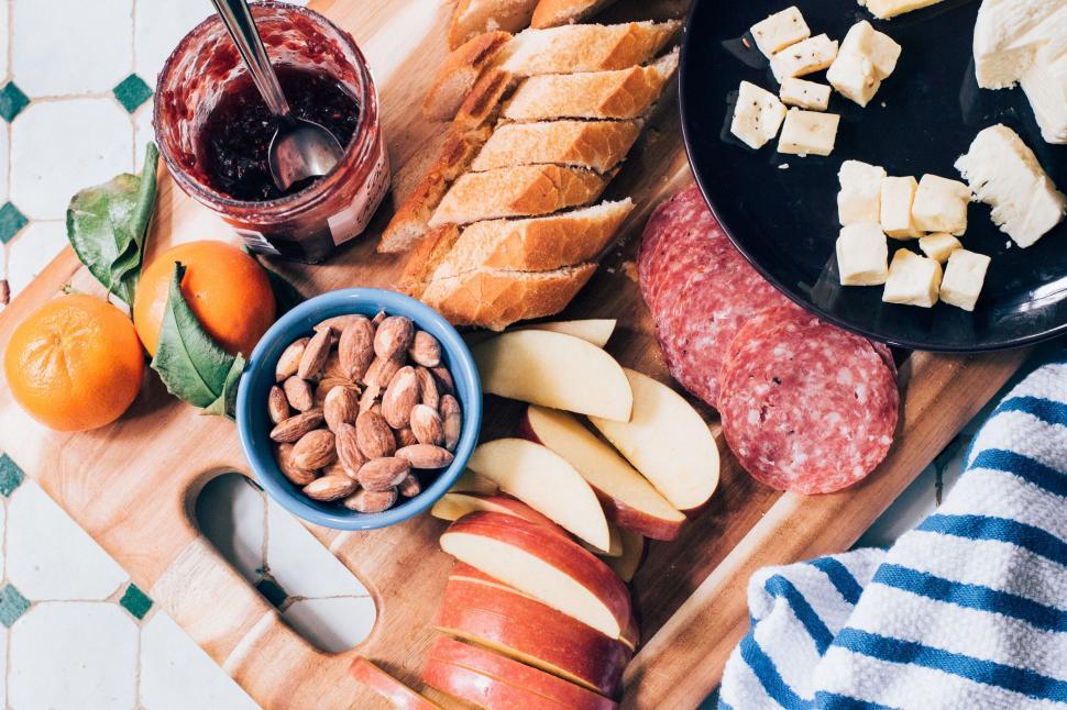 Free Image of Wooden Cutting Board Covered With Assorted Food Items 