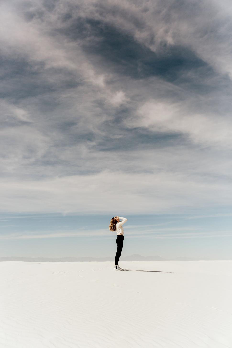 Free Image of Person Standing in Snow Covered Field 
