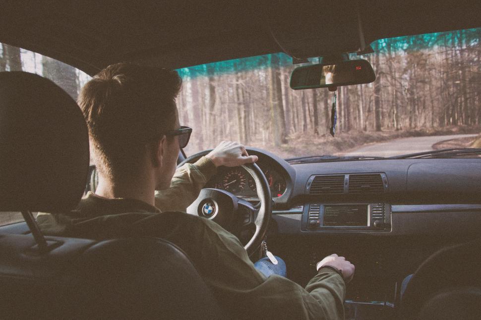 Free Image of Man Driving Car on Dirt Road 