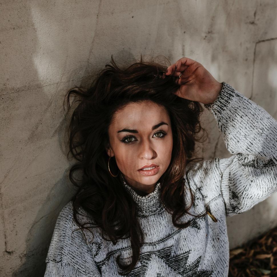 Free Image of Woman Posing With Wind-Blown Hair 
